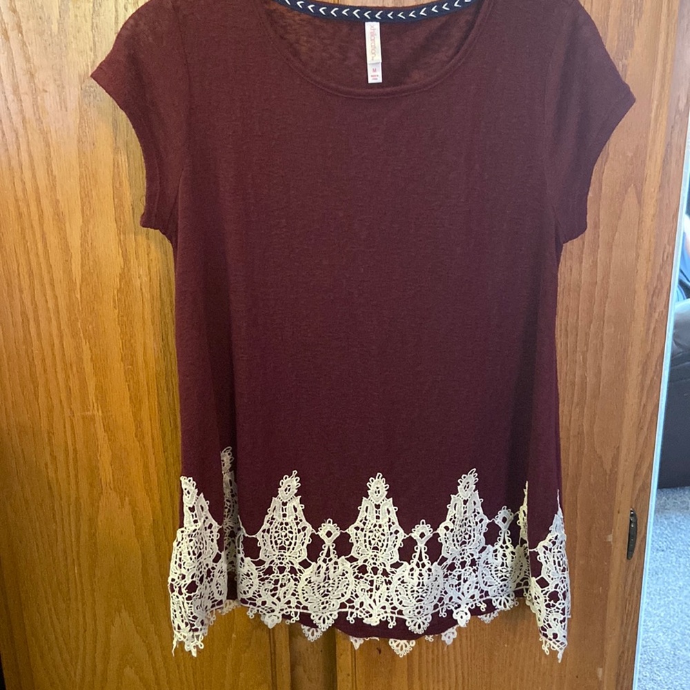 Womens short sleeve Xhileration top.  Crochet lace detailing at the hem.  Size M